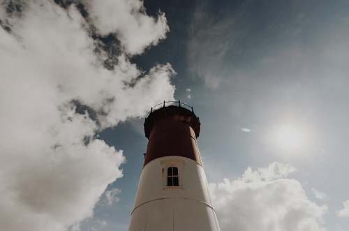 nauset lighthouse high-angle photography of white and black lighthouse tower during day time eastham